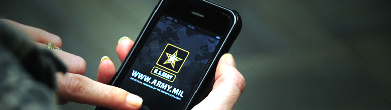 A person touching a smartphone which is displaying the U.S. Army website.